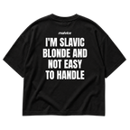 Back view of the black I'M SLAVIC BLONDE AND NOT EASY TO HANDLE Oversized T-Shirt by MALVICE.