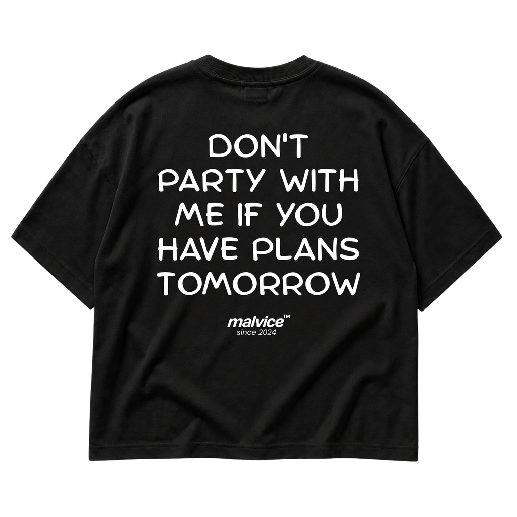 Back view of the black DON'T PARTY WITH ME IF YOU HAVE PLANS TOMORROW Oversized T-Shirt by MALVICE.
