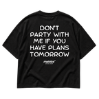Back view of the black DON'T PARTY WITH ME IF YOU HAVE PLANS TOMORROW Oversized T-Shirt by MALVICE.