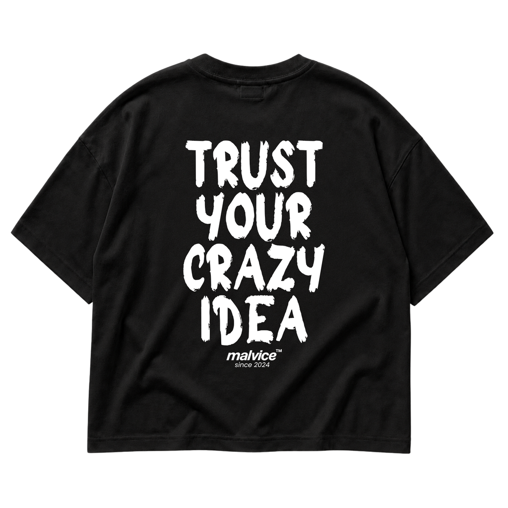 Back view of the black TRUST YOUR CRAZY IDEA Oversized T-Shirt by MALVICE, bold brush lettering.