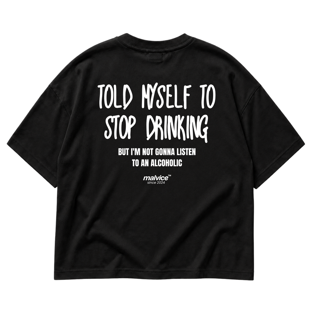 Back view of the black TOLD MYSELF TO STOP DRINKING Oversized T-Shirt by MALVICE.