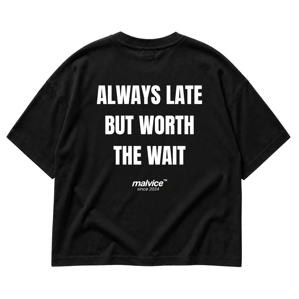 Back view of the black ALWAYS LATE BUT WORTH THE WAIT Oversized T-Shirt by MALVICE.