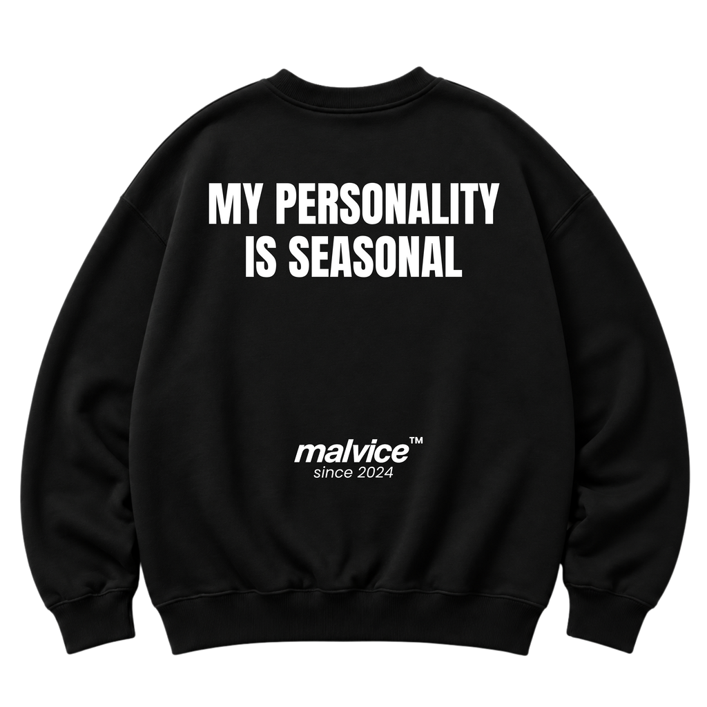 Black MALVICE oversized sweatshirt with “MY PERSONALITY IS SEASONAL” back print