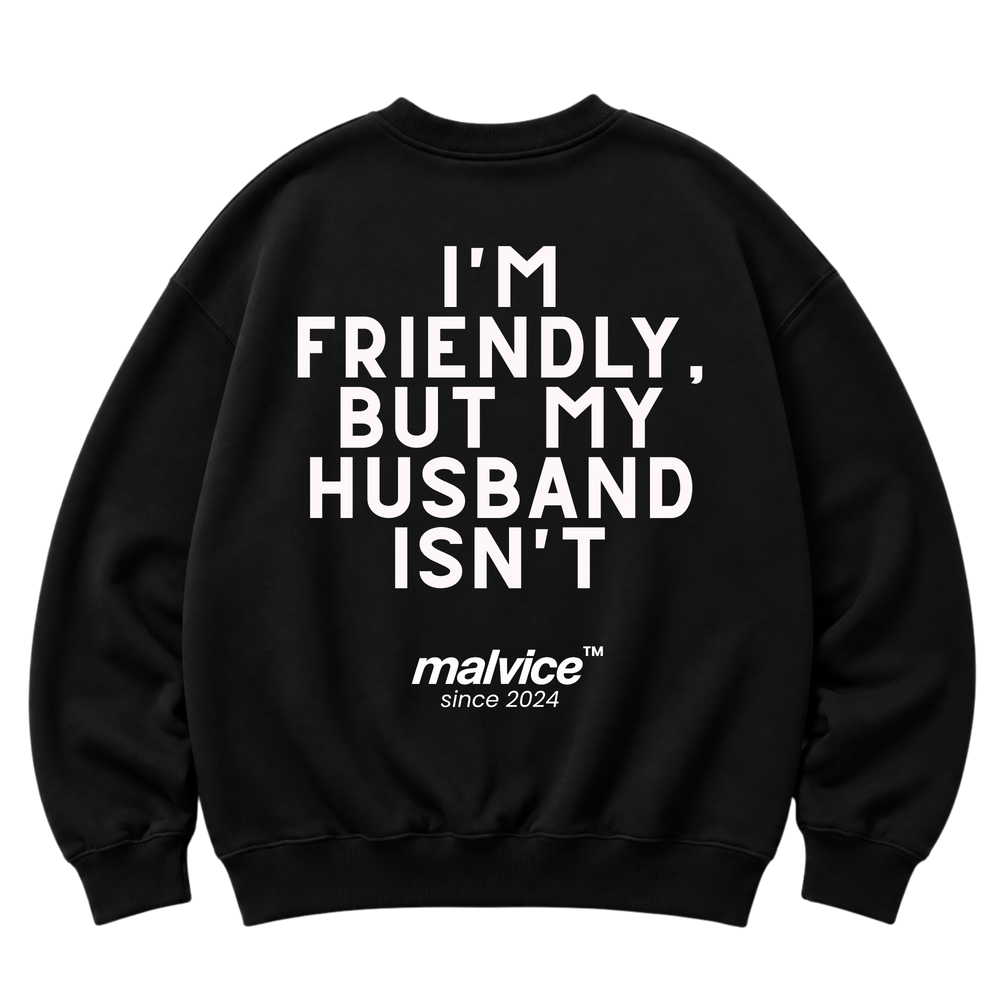 Black MALVICE oversized sweatshirt with “I'M FRIENDLY, BUT MY HUSBAND ISN'T” back print
