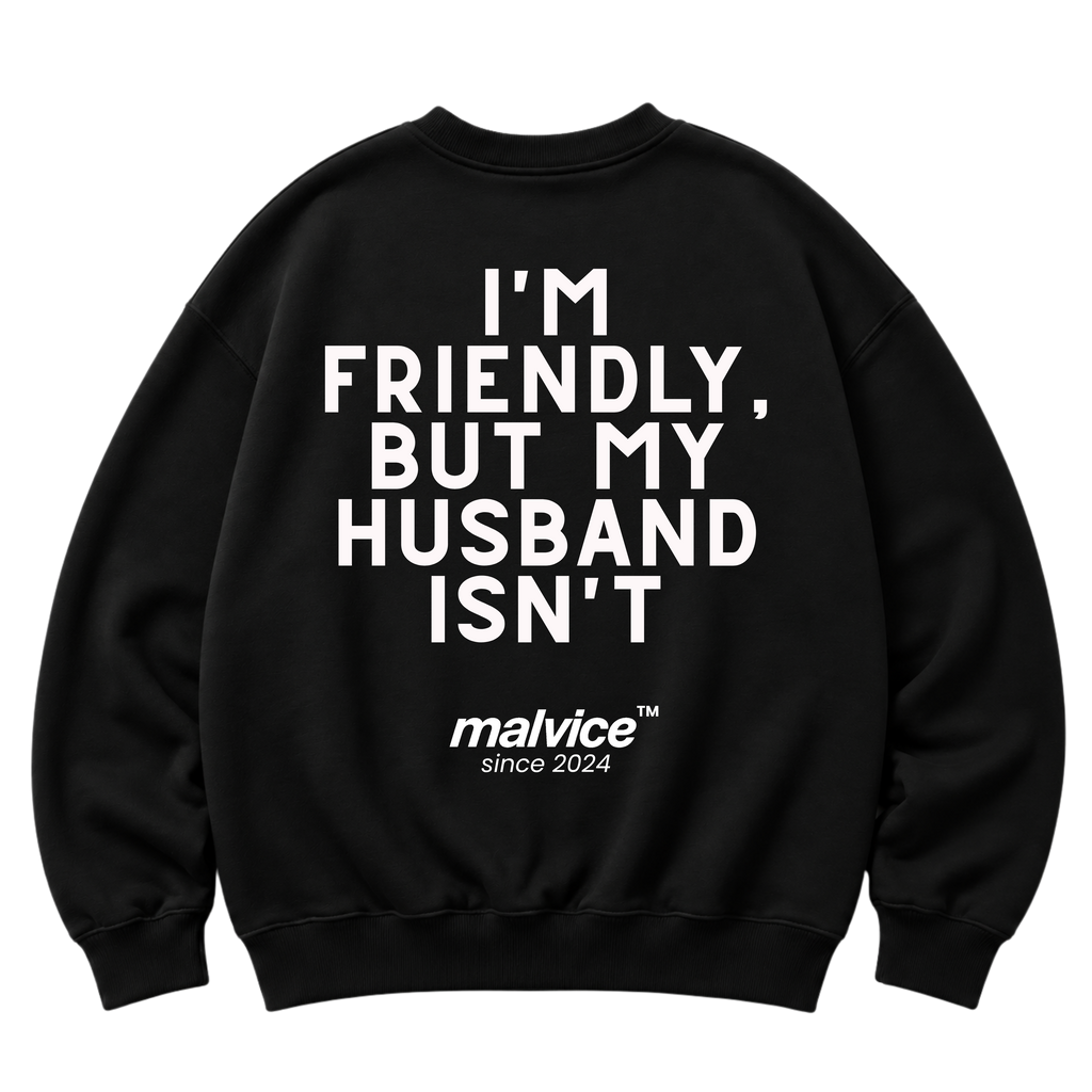 Black MALVICE oversized sweatshirt with “I'M FRIENDLY, BUT MY HUSBAND ISN'T” back print