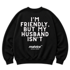 Black MALVICE oversized sweatshirt with “I'M FRIENDLY, BUT MY HUSBAND ISN'T” back print