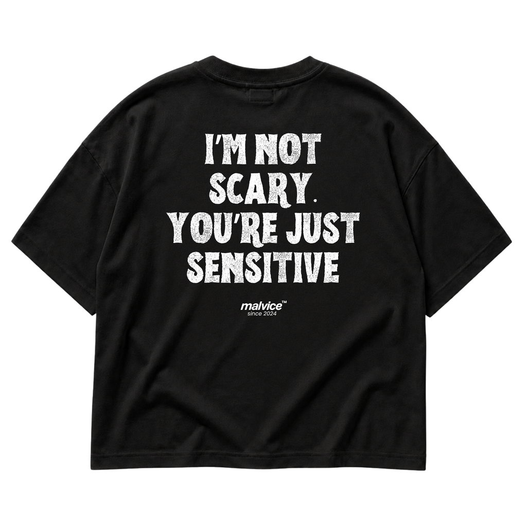 Black MALVICE oversized T-shirt with “I’M NOT SCARY. YOU’RE JUST SENSITIVE” back print