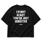 Black MALVICE oversized T-shirt with “I’M NOT SCARY. YOU’RE JUST SENSITIVE” back print