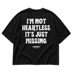 Black MALVICE oversized T-shirt with “I’M NOT HEARTLESS. IT’S JUST MISSING” back print