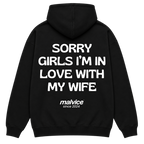 Black MALVICE oversized hoodie with “SORRY GIRLS I’M IN LOVE WITH MY WIFE” back print