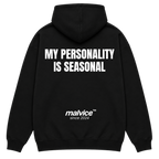 Black MALVICE oversized hoodie with “MY PERSONALITY IS SEASONAL” back print