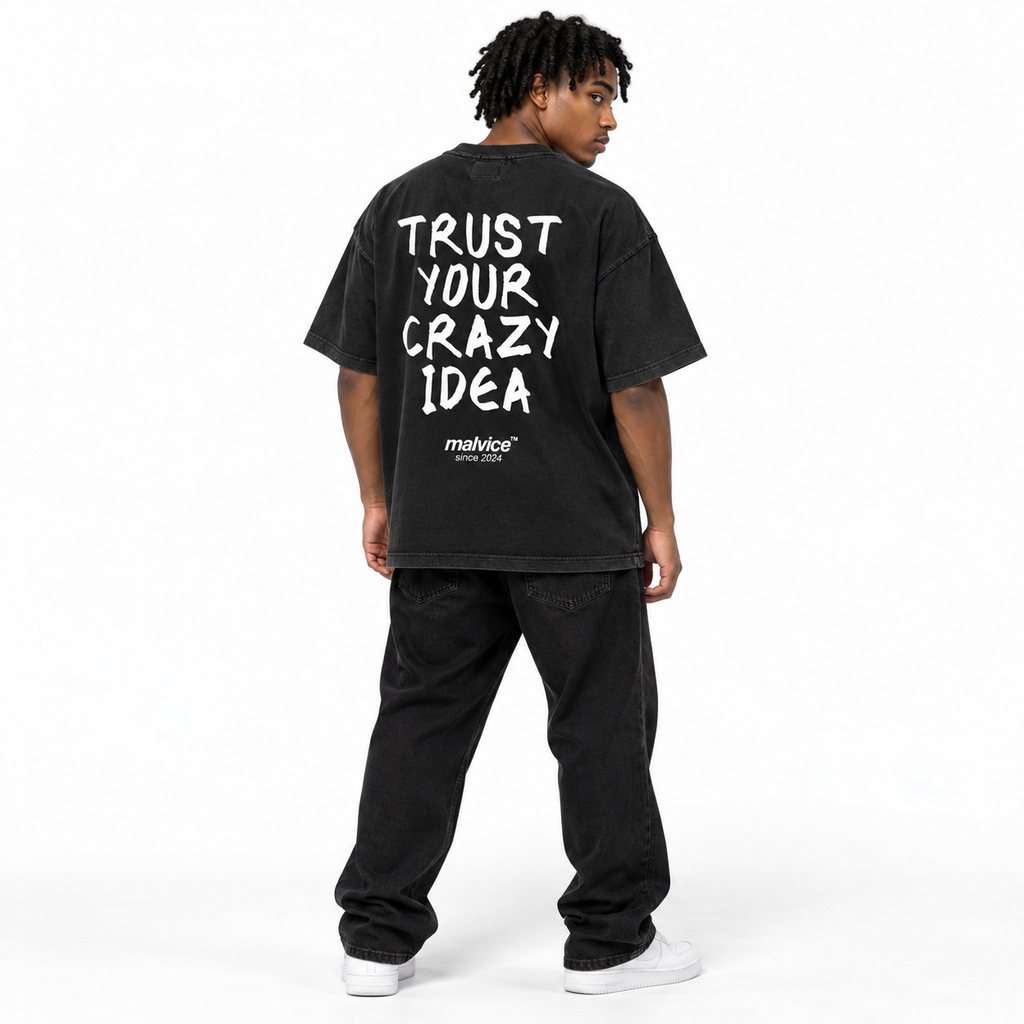 TRUST YOUR CRAZY IDEA Oversized T-Shirt black young adult model back view