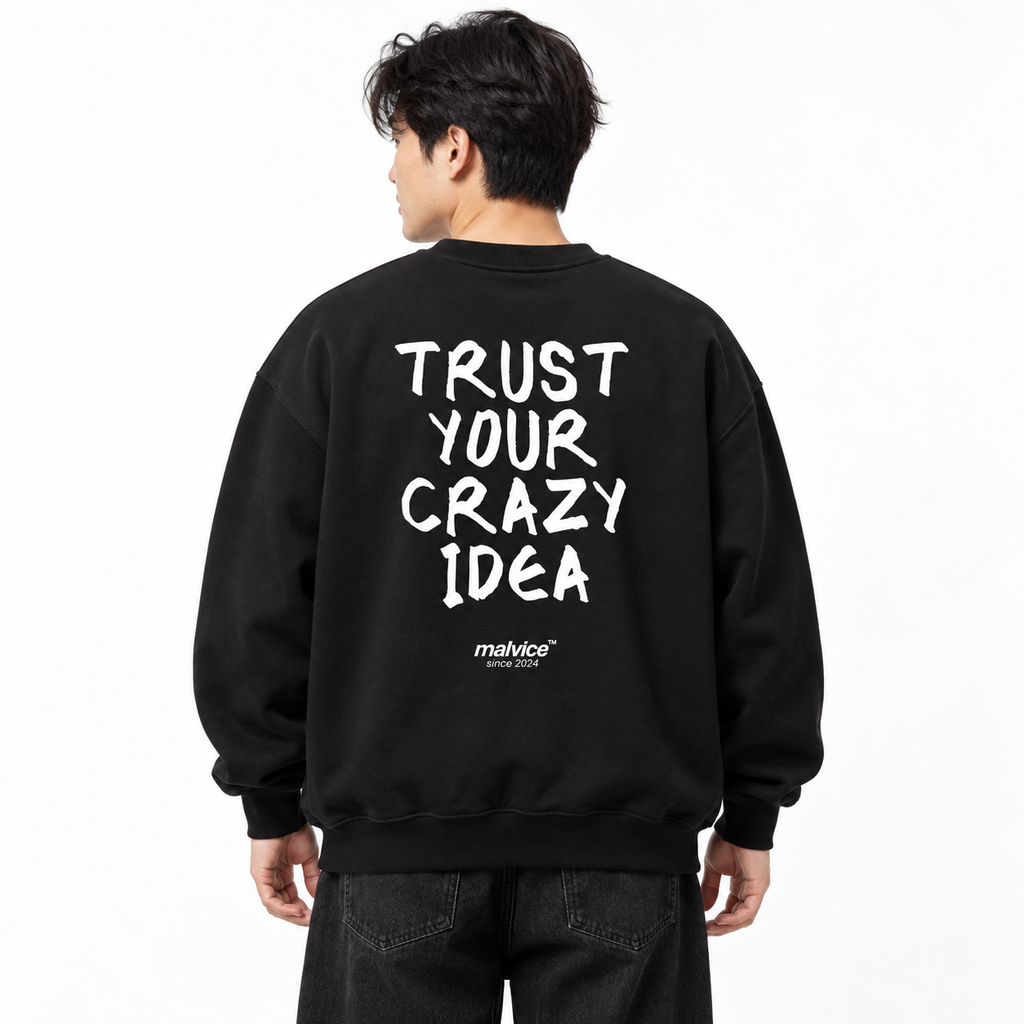 TRUST YOUR CRAZY IDEA Oversized Sweatshirt black young adult model back view