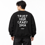 TRUST YOUR CRAZY IDEA Oversized Sweatshirt black young adult model back view