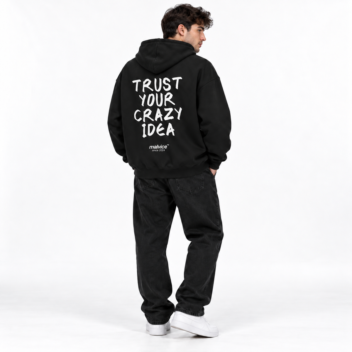 TRUST YOUR CRAZY IDEA Oversized Hoodie black young adult model back view