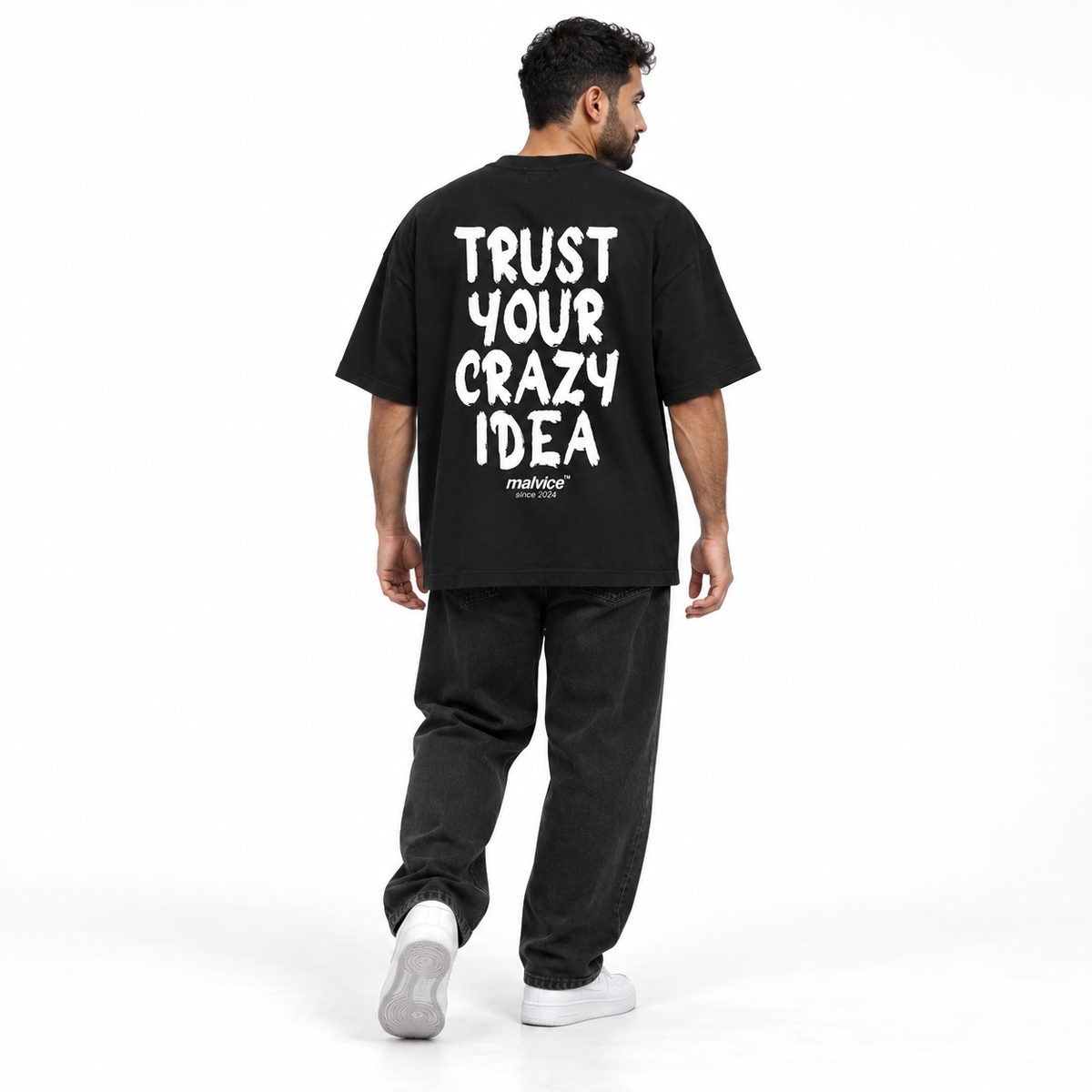 TRUST YOUR CRAZY IDEA Oversized T-Shirt black young adult model back view