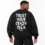 TRUST YOUR CRAZY IDEA Oversized Sweatshirt black young adult model back view