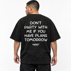 DON'T PARTY WITH ME IF YOU HAVE PLANS TOMORROW Oversized T-Shirt black young adult model back view