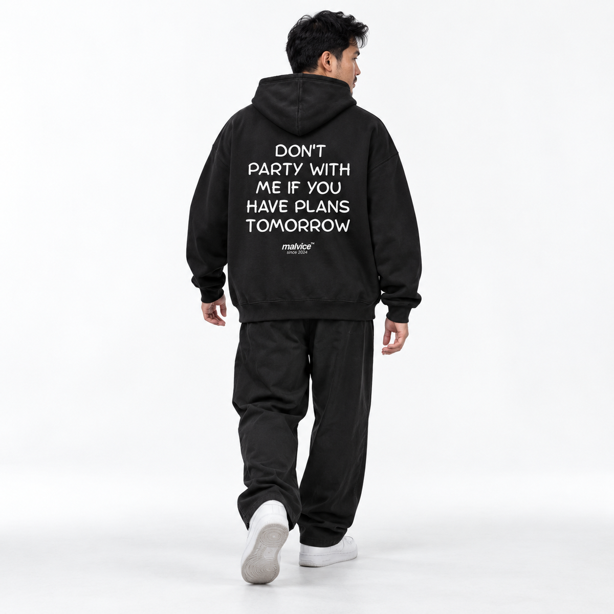DON'T PARTY WITH ME IF YOU HAVE PLANS TOMORROW Oversized Hoodie black young adult model back view