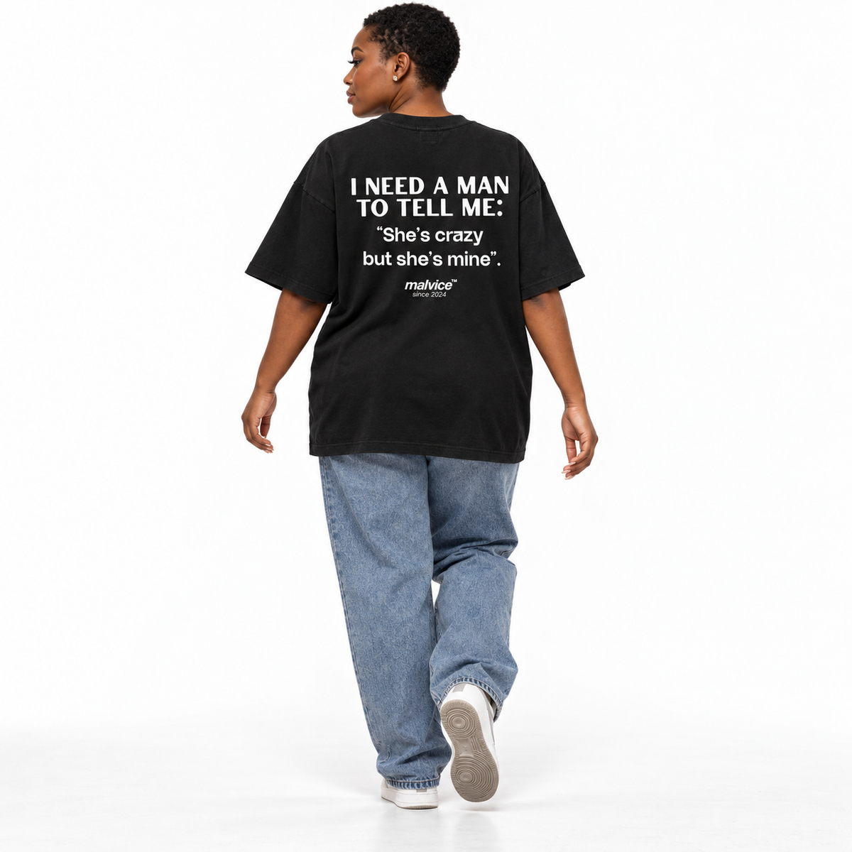 I NEED A MAN TO TELL ME: She’s crazy but she’s mine Oversized T-Shirt black young adult model back view