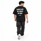 ALWAYS LATE BUT WORTH THE WAIT Oversized T-Shirt black young adult model back view