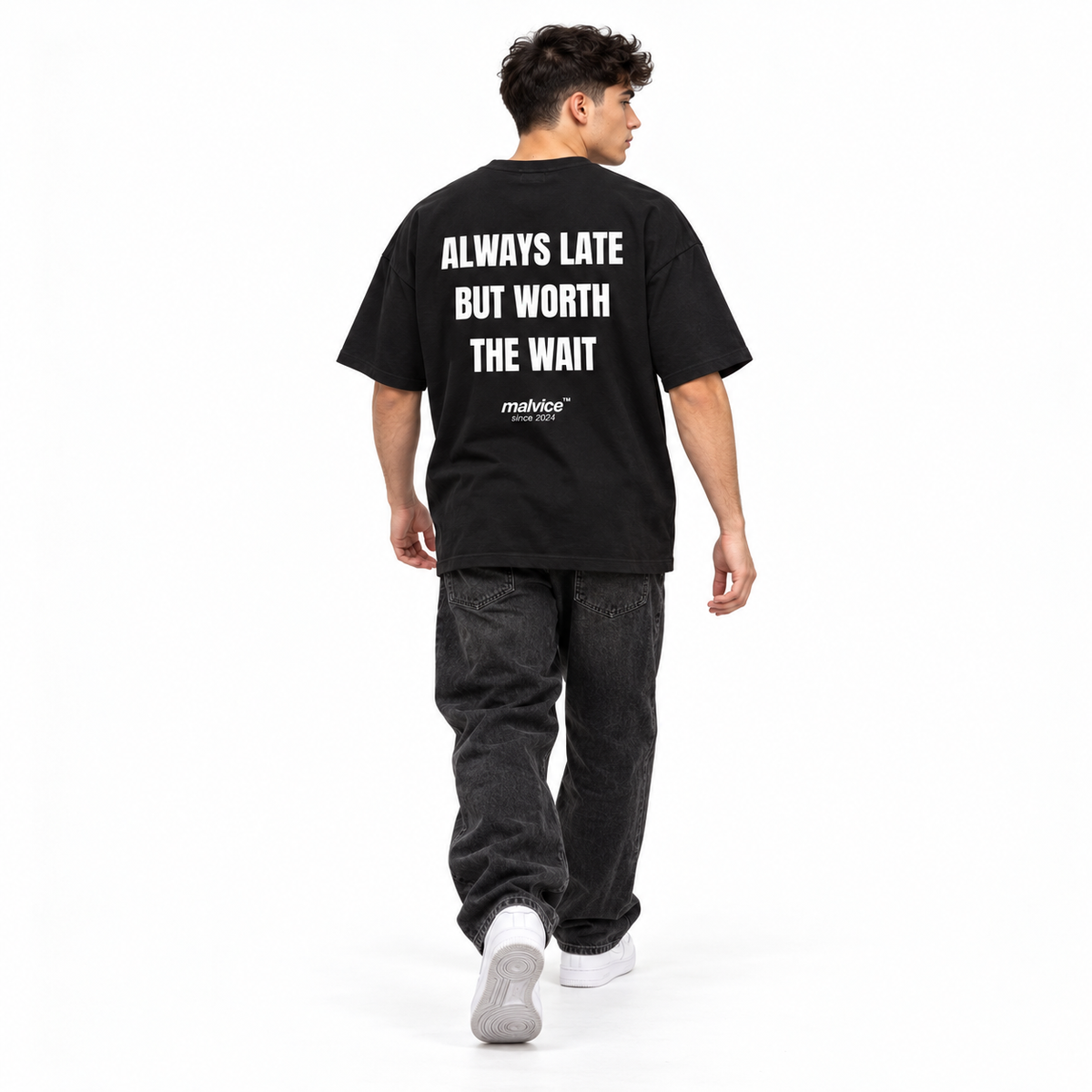 ALWAYS LATE BUT WORTH THE WAIT Oversized T-Shirt black young adult model back view