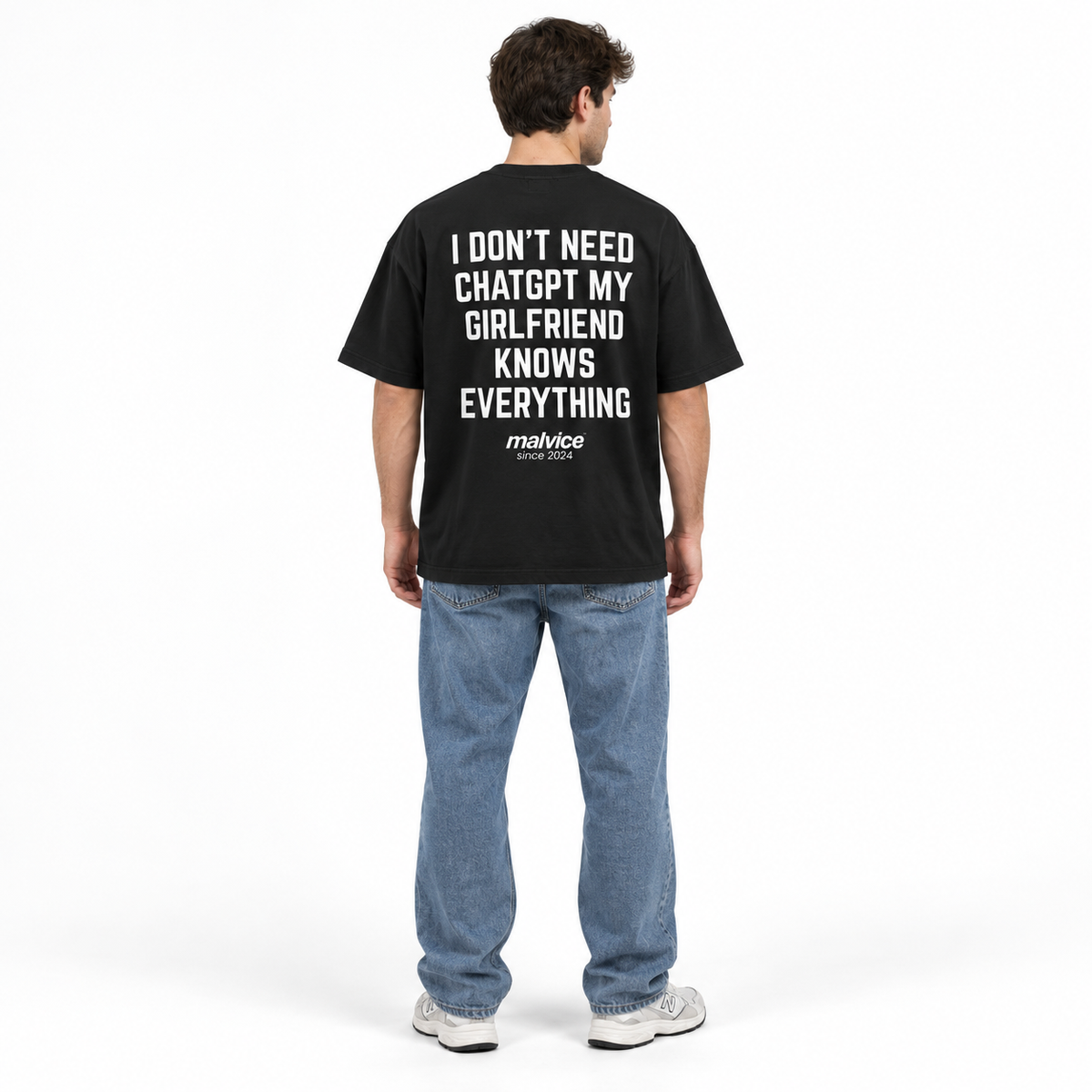 I DON'T NEED CHATGPT MY GIRLFRIEND KNOWS EVERYTHING Oversized T-Shirt — black T-Shirt on man model, white studio