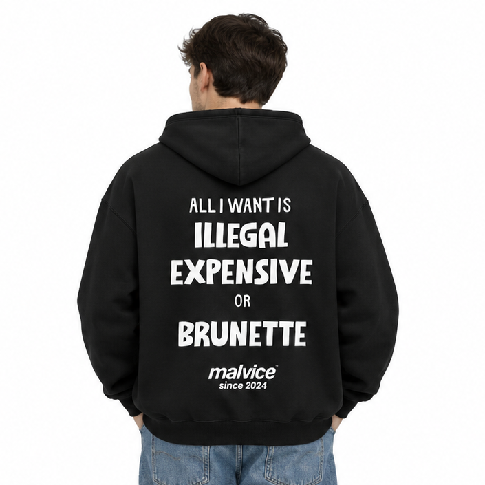 ALL I WANT IS ILLEGAL EXPENSIVE OR BRUNETTE Oversized Hoodie — black Hoodie on man model, white studio