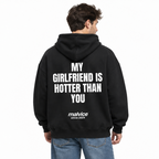 MY GIRLFRIEND IS HOTTER THAN YOU Oversized Hoodie — black Hoodie on man model, white studio