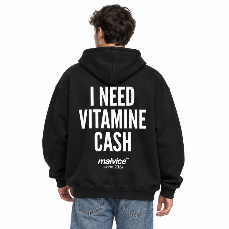 I NEED VITAMIN CASH Oversized Hoodie — black Hoodie on man model, white studio