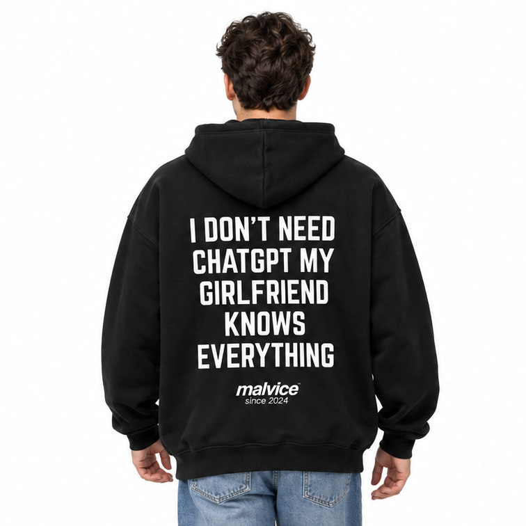 I DON'T NEED CHATGPT MY GIRLFRIEND KNOWS EVERYTHING Oversized Hoodie — black Hoodie on man model, white studio