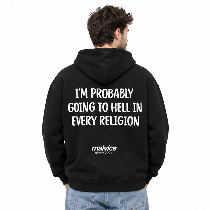 I'M PROBABLY GOING TO HELL IN EVERY RELIGION Oversized Hoodie — black Hoodie on man model, white studio