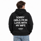 SORRY GIRLS I’M IN LOVE WITH MY WIFE Oversized Hoodie — black Hoodie on man model, white studio