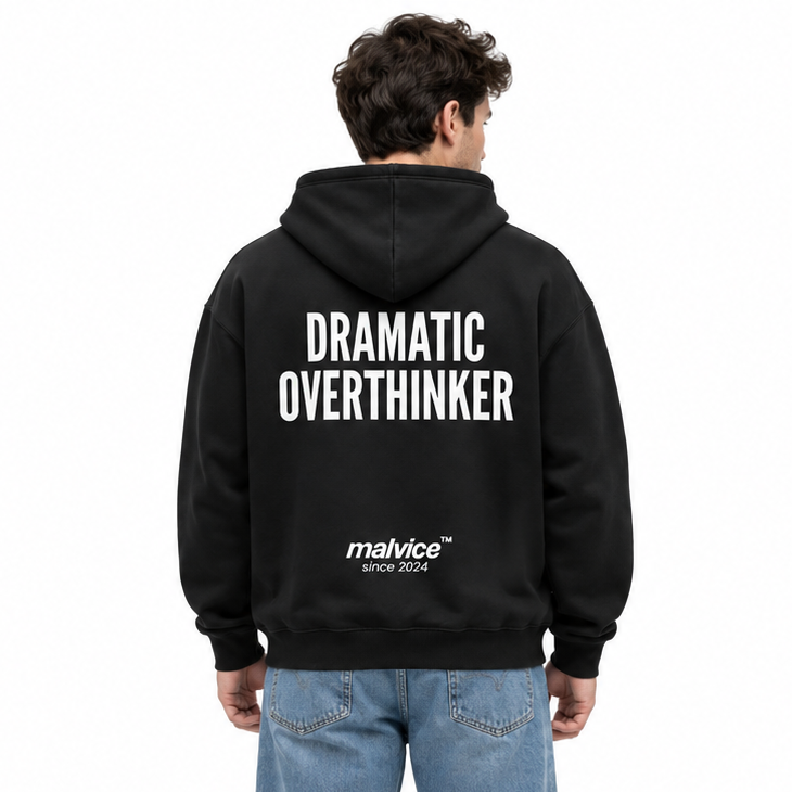 DRAMATIC OVERTHINKER Oversized Hoodie — black Hoodie on man model, white studio
