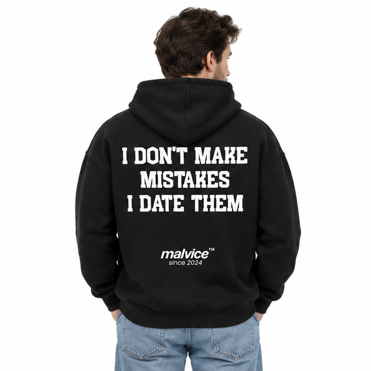 I DON'T MAKE MISTAKES I DATE THEM Oversized Hoodie — black Hoodie on man model, white studio