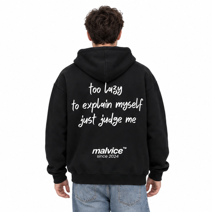 TOO LAZY TO EXPLAIN MYSELF JUST JUDGE ME Oversized Hoodie — black Hoodie on man model, white studio