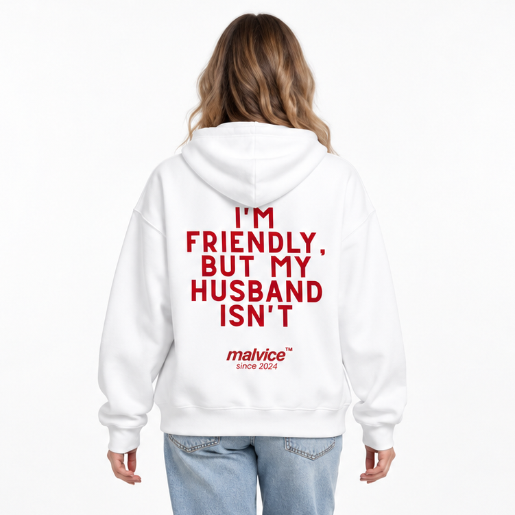 I'M FRIENDLY, BUT MY HUSBAND ISN'T Oversized Hoodie — white Hoodie on woman model, white studio