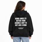 BEING SINGLE IS BETTER THAN ASKING A BOY TO ACT LIKE A MAN Oversized Hoodie — black Hoodie on woman model, white studio