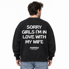 SORRY GIRLS I’M IN LOVE WITH MY WIFE Oversized Sweatshirt — black Sweatshirt on man model, white studio
