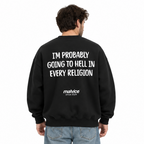 I'M PROBABLY GOING TO HELL IN EVERY RELIGION Oversized Sweatshirt — black Sweatshirt on man model, white studio