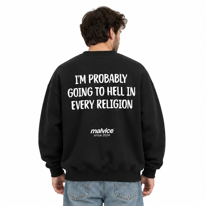 I'M PROBABLY GOING TO HELL IN EVERY RELIGION Oversized Sweatshirt — black Sweatshirt on man model, white studio