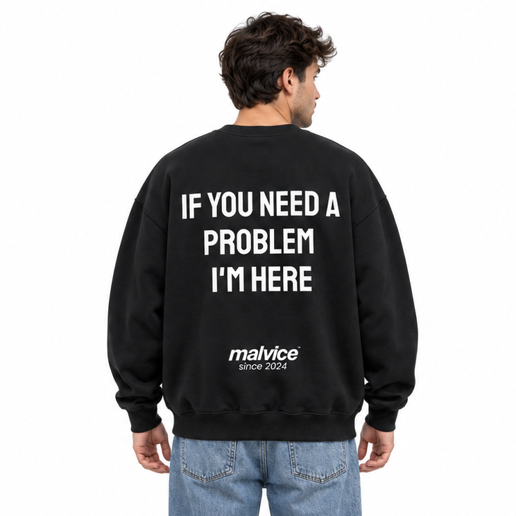 IF YOU NEED A PROBLEM I'M HERE Oversized Sweatshirt — black Sweatshirt on man model, white studio