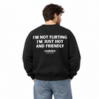 I'M NOT FLIRTING I'M JUST HOT AND FRIENDLY Oversized Sweatshirt — black Sweatshirt on man model, white studio