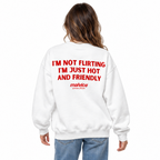 I'M NOT FLIRTING I'M JUST HOT AND FRIENDLY Oversized Sweatshirt — white Sweatshirt on woman model, white studio