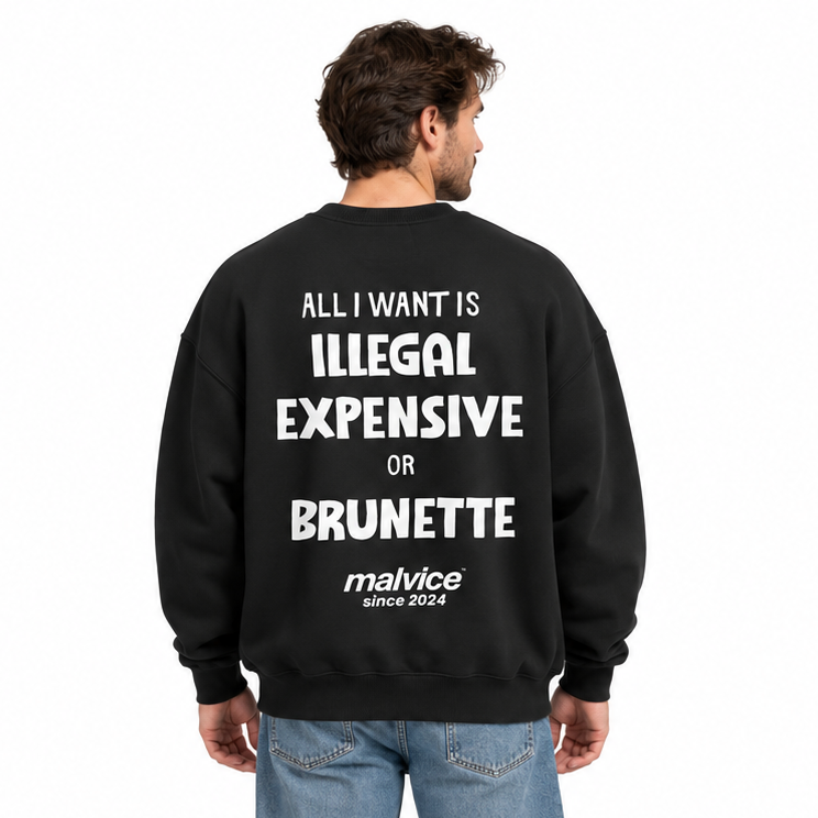 ALL I WANT IS ILLEGAL EXPENSIVE OR BRUNETTE Oversized Sweatshirt — black Sweatshirt on man model, white studio