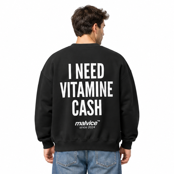 I NEED VITAMIN CASH Oversized Sweatshirt — black Sweatshirt on man model, white studio