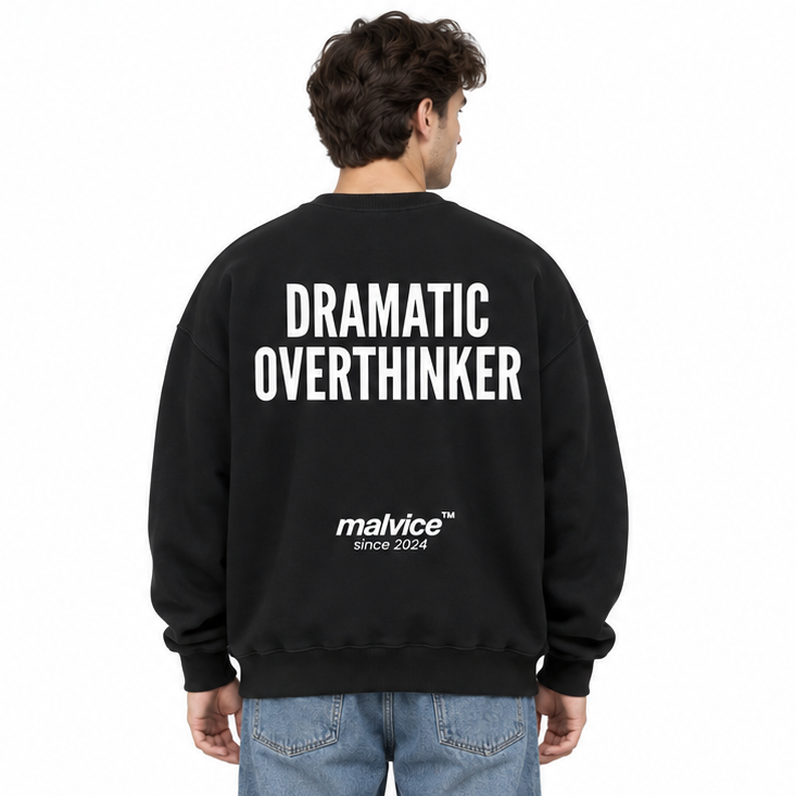 DRAMATIC OVERTHINKER Oversized Sweatshirt — black Sweatshirt on man model, white studio