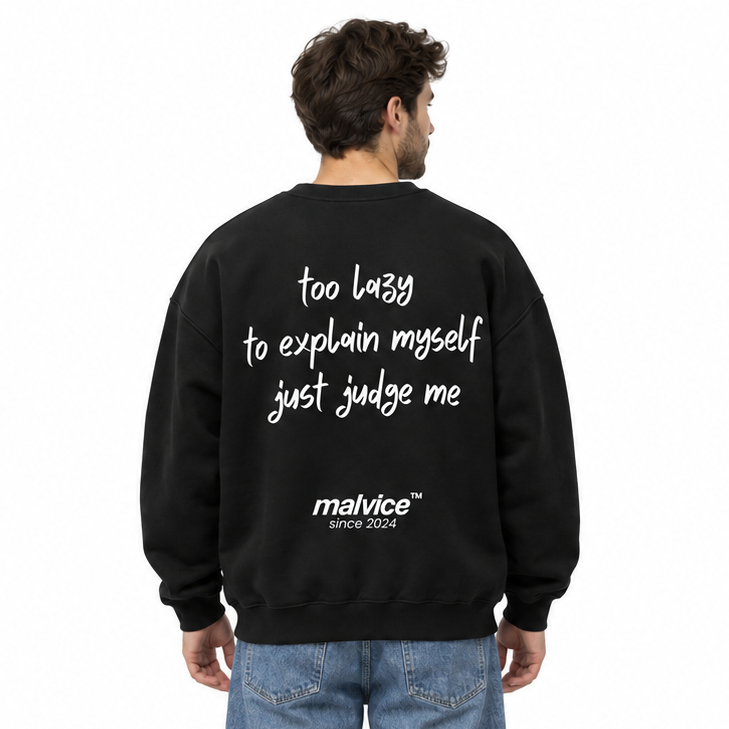 TOO LAZY TO EXPLAIN MYSELF JUST JUDGE ME Oversized Sweatshirt — black Sweatshirt on man model, white studio