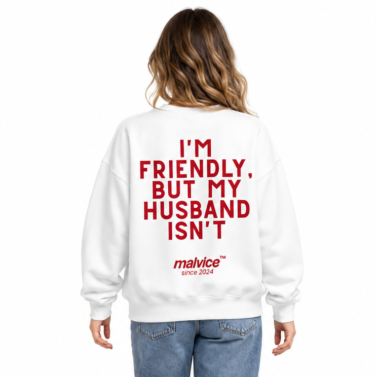 I'M FRIENDLY, BUT MY HUSBAND ISN'T Oversized Sweatshirt — white Sweatshirt on woman model, white studio