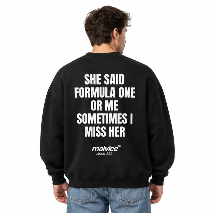 SHE SAID FORMULA ONE OR ME SOMETIMES I MISS HER Oversized Sweatshirt — black Sweatshirt on man model, white studio